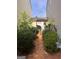 Small, private backyard with a gated entry and well-manicured shrubs at 449 Kara Ln, Mcdonough, GA 30253