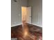 Spacious bedroom with hardwood floors and access to another room at 449 Kara Ln, Mcdonough, GA 30253