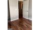 Bedroom with hardwood floors and access to hallway at 449 Kara Ln, Mcdonough, GA 30253