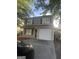 Two story house with attached garage and landscaping at 449 Kara Ln, Mcdonough, GA 30253