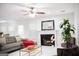 Spacious living room with a fireplace, large windows and comfy seating at 132 Sunflower Meadows Dr, Mcdonough, GA 30252