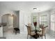 Cozy breakfast nook with a glass-top table and four chairs at 132 Sunflower Meadows Dr, Mcdonough, GA 30252