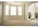 Open living room with neutral colors, bay windows and carpet flooring at 132 Sunflower Meadows Dr, Mcdonough, GA 30252