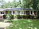 Brick ranch house with mature landscaping and a large yard at 2093 Wildrose Dr, Decatur, GA 30032