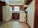 Kitchen with wood cabinets, refrigerator and stove at 2093 Wildrose Dr, Decatur, GA 30032