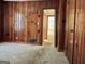 Bedroom with wood paneling walls and carpeted floor at 2093 Wildrose Dr, Decatur, GA 30032