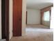 View of living area from hallway with carpet at 2093 Wildrose Dr, Decatur, GA 30032