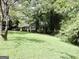 Brick ranch home situated on a large lot with lush lawn at 2093 Wildrose Dr, Decatur, GA 30032