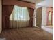 Living Room with light brown carpet and draped window at 2093 Wildrose Dr, Decatur, GA 30032