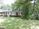 Brick ranch house nestled in a wooded area at 2093 Wildrose Dr, Decatur, GA 30032