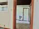 Bedroom with door and view into another room at 2093 Wildrose Dr, Decatur, GA 30032