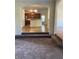Open living area with views into the kitchen and other rooms at 7495 St David St, Fairburn, GA 30213