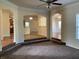 Open living room with views into kitchen and other rooms at 7495 St David St, Fairburn, GA 30213