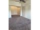 Large main bedroom with carpet and ceiling fan at 7495 St David St, Fairburn, GA 30213