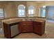 Kitchen island with sink, dishwasher, and ample counter space at 7495 St David St, Fairburn, GA 30213