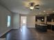 Open living room and kitchen with hardwood floors at 5716 Laney Dr, Rex, GA 30273