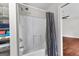 Bathroom with shower/tub combo and linen storage at 12 Fairway Ln, Peachtree City, GA 30269