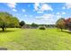 Community tennis courts nestled in a grassy area at 12 Fairway Ln, Peachtree City, GA 30269