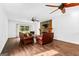 Living room with brown leather sofas and stone fireplace at 12 Fairway Ln, Peachtree City, GA 30269