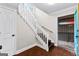 Bright entryway with staircase, wood floors, and access to exterior deck at 12 Fairway Ln, Peachtree City, GA 30269