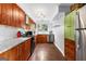 Modern kitchen with granite countertops and wooden cabinets at 12 Fairway Ln, Peachtree City, GA 30269