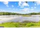 Serene lake view with a small island at 12 Fairway Ln, Peachtree City, GA 30269