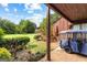 Covered patio with golf cart and view of backyard at 12 Fairway Ln, Peachtree City, GA 30269