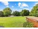 Landscaped yard with scenic views and community at 12 Fairway Ln, Peachtree City, GA 30269