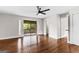 Spacious bedroom with wood floors and sliding glass doors to deck at 12 Fairway Ln, Peachtree City, GA 30269