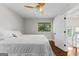 Bright bedroom featuring a ceiling fan and wood floors at 12 Fairway Ln, Peachtree City, GA 30269