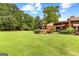 Aerial view of home and surrounding green space at 12 Fairway Ln, Peachtree City, GA 30269