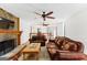 Spacious living room with hardwood floors and a view into the dining area at 12 Fairway Ln, Peachtree City, GA 30269