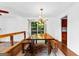 Dining area with wood table, chandelier, and kitchen access at 12 Fairway Ln, Peachtree City, GA 30269