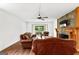 Spacious living room with fireplace and hardwood floors at 12 Fairway Ln, Peachtree City, GA 30269