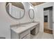 Double vanity bathroom with granite countertop and wood-look flooring at 2752 Poplar Rd, Sharpsburg, GA 30277