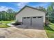 Two car garage with gray doors at 2752 Poplar Rd, Sharpsburg, GA 30277