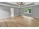 Large bedroom with wood-look floors and a window at 2752 Poplar Rd, Sharpsburg, GA 30277