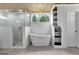 Spa-like bathroom, featuring a soaking tub and glass shower at 2752 Poplar Rd, Sharpsburg, GA 30277