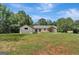 Ranch style home with a large backyard at 2752 Poplar Rd, Sharpsburg, GA 30277
