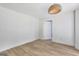 Simple bedroom with light walls and hardwood floors at 2752 Poplar Rd, Sharpsburg, GA 30277