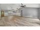 Spacious living room with hardwood floors, vaulted ceiling, and ceiling fans at 2752 Poplar Rd, Sharpsburg, GA 30277