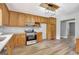 Stylish kitchen boasting stainless steel appliances and light wood cabinets at 2752 Poplar Rd, Sharpsburg, GA 30277
