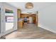 Eat-in kitchen with modern pendant lighting and hardwood floors at 2752 Poplar Rd, Sharpsburg, GA 30277