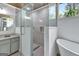 Updated bathroom with a large glass shower and vanity at 2752 Poplar Rd, Sharpsburg, GA 30277