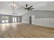 Spacious living room featuring hardwood floors, vaulted ceiling, and chandelier at 2752 Poplar Rd, Sharpsburg, GA 30277