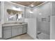 Bathroom with gray vanity, walk-in shower, and granite at 2752 Poplar Rd, Sharpsburg, GA 30277