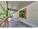 Relaxing porch with stone flooring and a swing at 2752 Poplar Rd, Sharpsburg, GA 30277