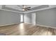 Bright bedroom featuring wood-look floors and a ceiling fan at 2752 Poplar Rd, Sharpsburg, GA 30277