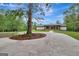 Ranch home with circular driveway and mature trees at 2752 Poplar Rd, Sharpsburg, GA 30277