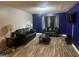 Living room featuring hardwood floors, and a neutral color palette at 8201 Fairington Village Dr, Lithonia, GA 30038